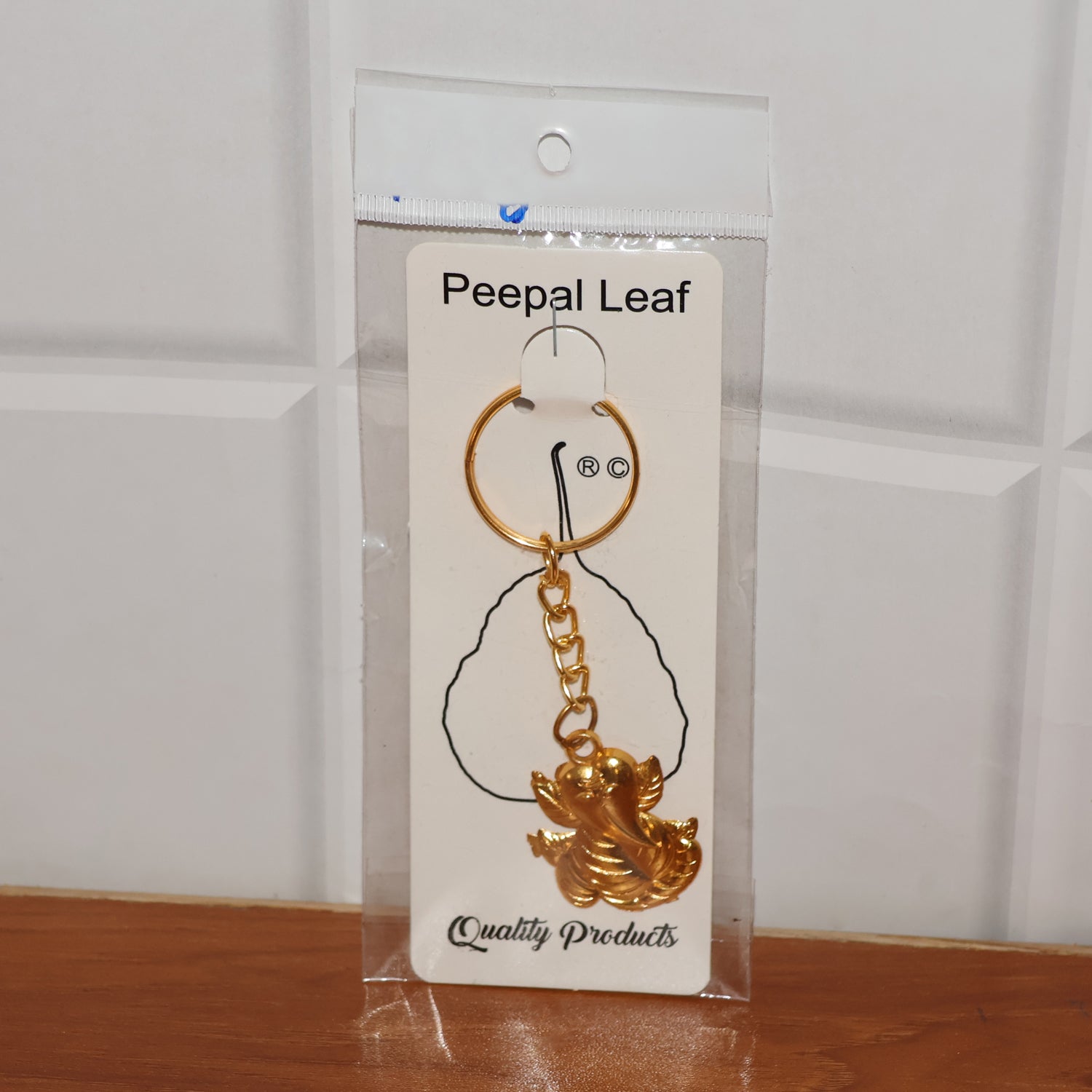 Golden Ganesh Leaf Design Keychain (1 Pc) signaturekarts